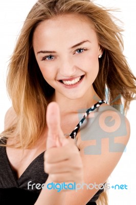 Happy Young Lady Showing Thumbs Up Stock Photo