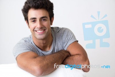 Happy Young Man Relaxing At Home Stock Photo