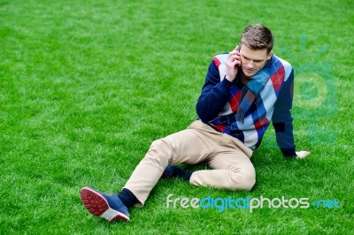 Happy Young Man Talking On Mobile Phone Stock Photo