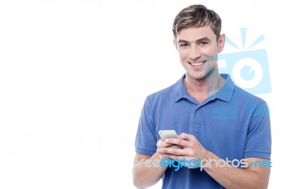 Happy Young Man Using Mobile Stock Photo