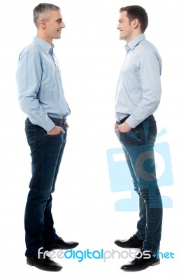 Happy Young Men Standing Together Stock Photo