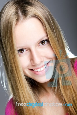 Happy Young Woman Looking At The Camera Stock Photo