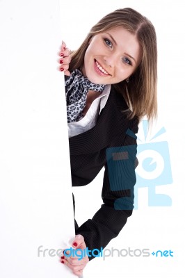 Happy Young Women Peeking Through A Blank Board Stock Photo