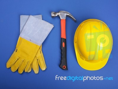 Hard Hat Hammer And Leather Gloves Stock Photo