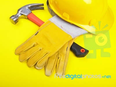 Hard Hat Hammer And Leather Gloves Stock Photo