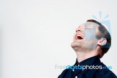 Hard Laughing Middle Aged Man Stock Photo