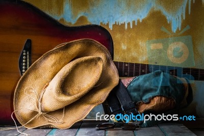 Hat And Guitar On Wooden Stock Photo