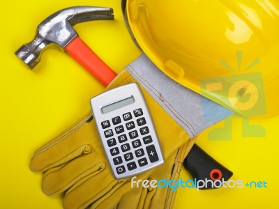 Hat Hammer Calculator and Gloves Stock Photo