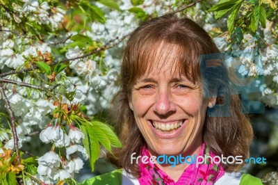 Head Of Woman Between White Flowers Stock Photo