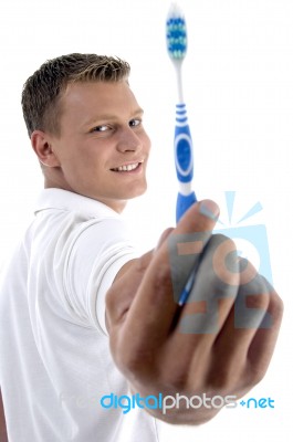 Health Care Man Showing His Toothbrush Stock Photo