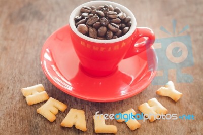 Healthy Alphabet Biscuit With Red Coffee Cup Stock Photo