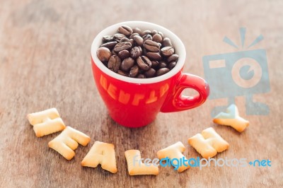 Healthy Alphabet Biscuit With Red Coffee Cup Stock Photo