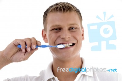 Healthy Male Cleaning His Teeth Stock Photo