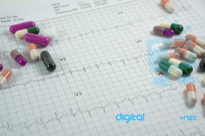 Heap Of Medicine Pills On Cardiogram Grid Paper. Selective Focus… Stock Photo