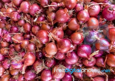 Heap Of Red Onions On Market Stock Photo