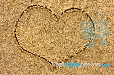 Heart Drawn In The Sand On A Sunny Day Stock Photo