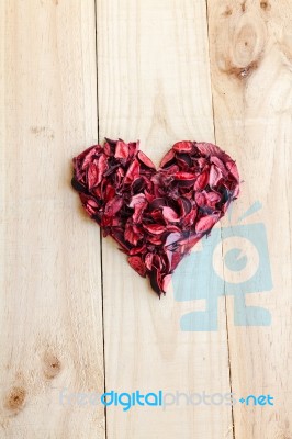 Heart Formed By Red Rose Petals On Wooden Background Stock Photo