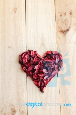 Heart Formed By Red Rose Petals On Wooden Background Stock Photo