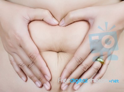 Heart Shape On Stomach Stock Photo