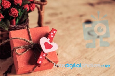 Heart-shaped And Gift On Wooden Stock Photo