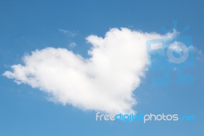 Heart Shaped White Cloud On Blue Sky Background Stock Photo