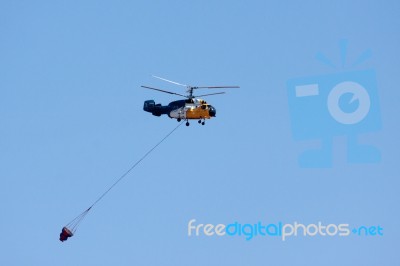 Helicopter Collecting Water Stock Photo