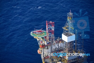 Helicopter Embark Passenger On The Offshore Oil Rig Stock Photo