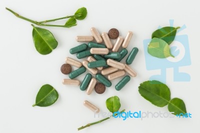 Herbal Medicine In Capsules With Kaffir Lime Leaf Stock Photo