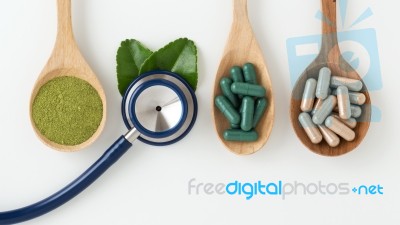 Herbal Medicine With Stethoscope On White Background Stock Photo