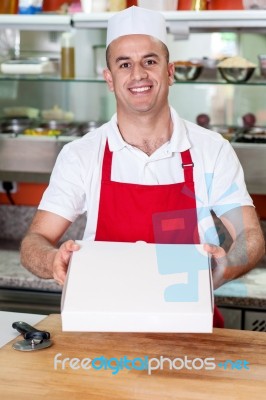 Here Is The Pizza You Ordered! Stock Photo