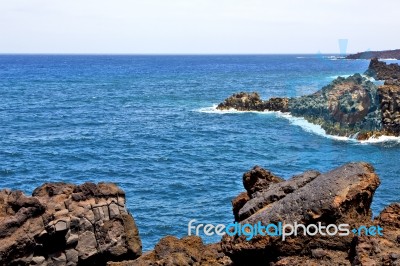 Hervideros Brown Rock In White Coast Lanzarote    Ummer Stock Photo