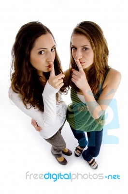 High Angle View Of Girls Shushing Stock Photo