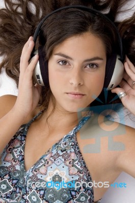 High Angle View Of High Angle View Of Laying Woman With Headphone Stock Photo