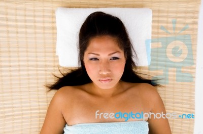 High Angle View Of Relaxing Female Looking At Camera Stock Photo