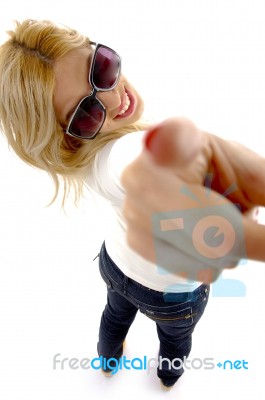 High Angle View Of Smiling Woman Pointing At Camera Stock Photo