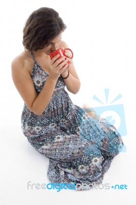 High Angle View Of Young Woman Drinking Coffee Stock Photo