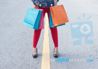 High Heels Girls With Shopping Bags Walking On Street Stock Photo