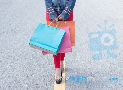 High Heels Girls With Shopping Bags Walking On Street Stock Photo