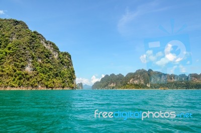 High Mountain Range Above The Green Lake Stock Photo