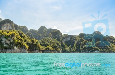 High Mountain Range Above The Green Lake Stock Photo