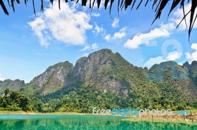 High Mountain Range Above The Green Lake Stock Photo