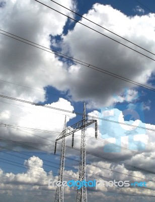 High Voltage Pilons And Storm Clouds Stock Photo