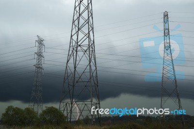 High Voltage Power Lines During A Storm Stock Photo