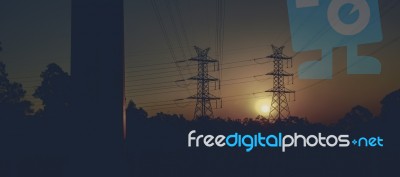 High Voltage Power Tower At Sunset Stock Photo