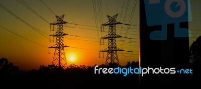 High Voltage Power Tower At Sunset Stock Photo