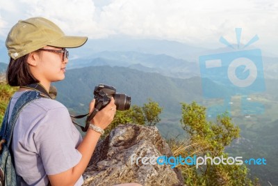 Hiker Teen Girl Holding A Camera For Photography Stock Photo