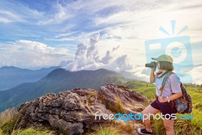 Hiker Teen Girl Holding A Camera For Photography Stock Photo