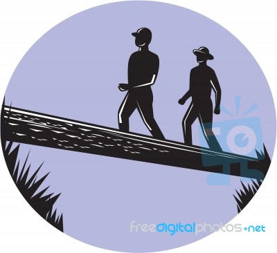 Hikers Crossing Single Log Bridge Oval Woodcut Stock Image