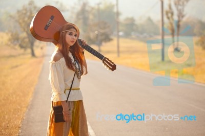 Hippie Girl Hitchhiking Stock Photo