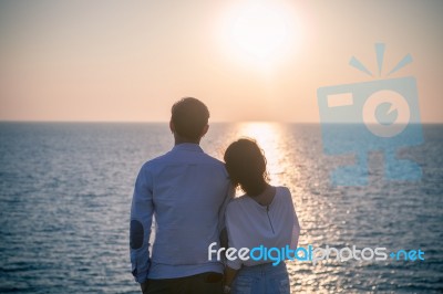 Hipster Photography Style Of Younger Love Couples Vacation Relaxing With Sun Set Sky At Destination Sea Side Happiness Emotion Stock Photo